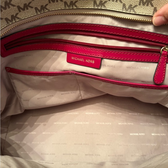 Michael Kors tote 19 length 11 wide zippered closures outside and out. 3 inside - Picture 8 of 11